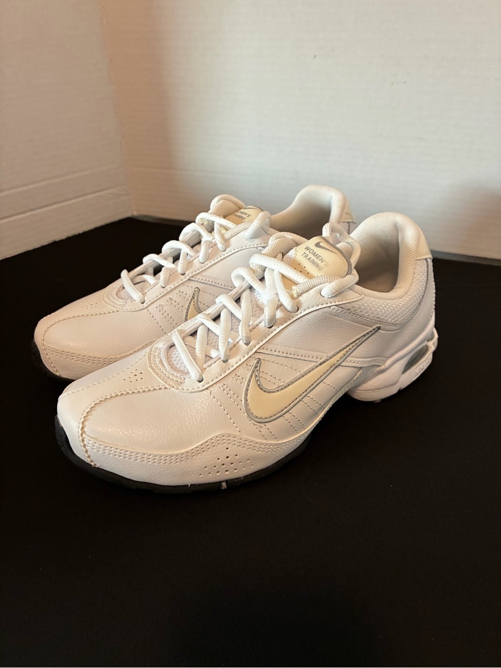 Nike women’s air exceed White Sneakers with Cream Swoosh